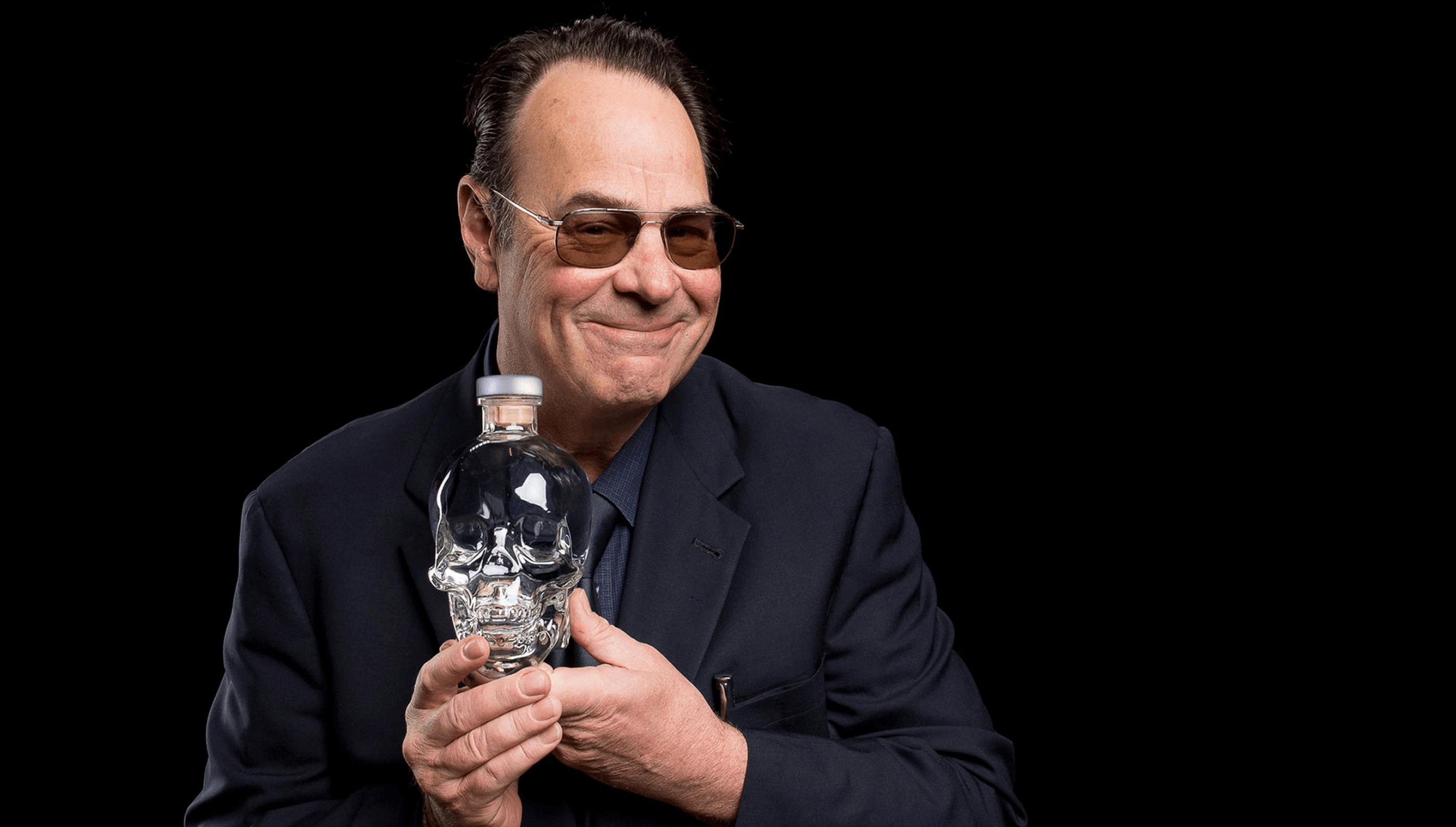 Dan poses with a bottle of Crystal Head Vodka